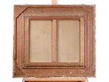 an old wooden easel with a painting on top of it on a white surface