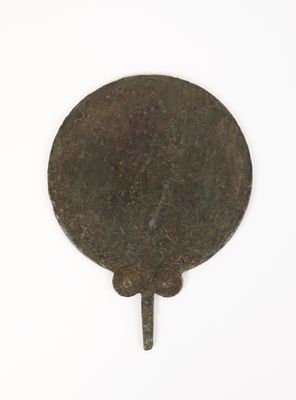 a small metal object that is on a white surface