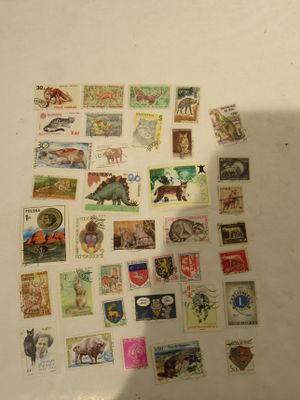 a lot of stamps that are on the table