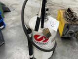 a vacuum that is sitting on the floor in a warehouse