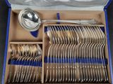 a box with a bunch of silverware in it