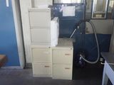 a stack of filing cabinets in the corner of a room