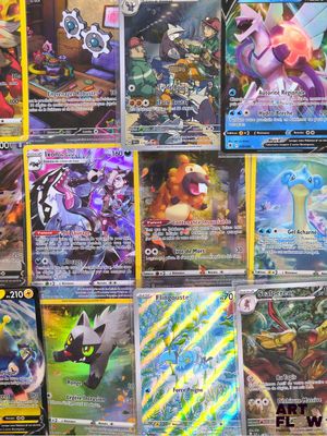 many different types of pokemon cards on the table