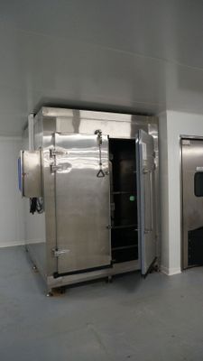 a large stainless steel freezer in the middle of a room