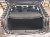 the back of a car with the trunk open and the seats folded down
