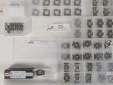 many different types of screws and nuts in the box
