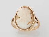 an 18k gold ring with a carved cameo of a woman