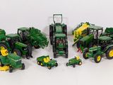 a lot of toy tractors that are sitting on a table