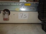 a picture of a sign on a wall in a garage