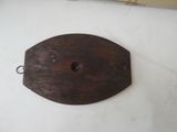 a wooden plate with a hole in the middle of it