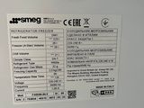 a label on the back of a white refrigerator