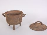 a small pot and a small pot on a stand