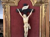 a wooden crucif with a banner on it