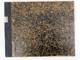 an old book with a black cover and gold speckles on it
