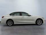the bmw 3 series sedan is parked in a white room