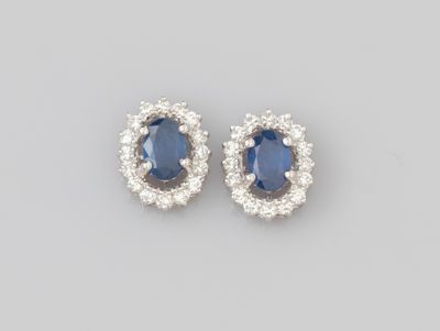 a pair of sapphire and diamond earrings