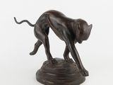 bronze statue of a cat on a pedestal on a white background