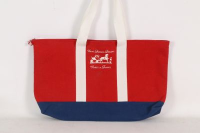 sac fourre-tout rouge et bleu avec des anses blanches et une anse blanche