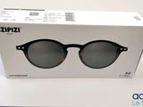 an open box of a pair of sunglasses sitting on top of a table