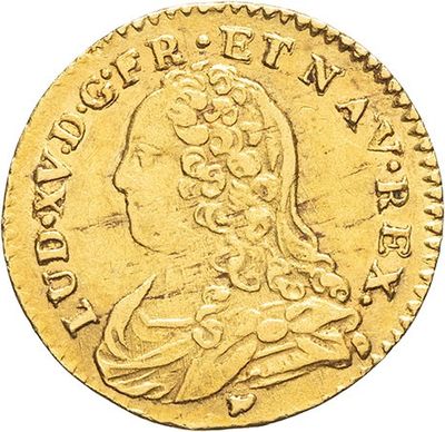 a gold coin with an image of a woman in profile