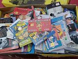 a box full of books sitting on a red floor