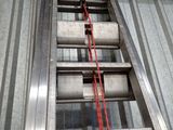 a ladder that is attached to the roof of a building