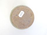 a jar with a label on it sitting on a table