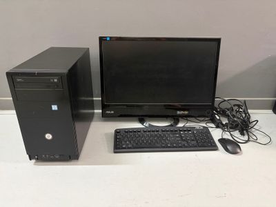 a desktop computer sitting on a desk next to a keyboard and mouse