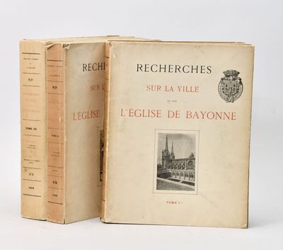 two books sitting on top of each other on a white surface