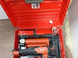 a red tool box with tools in it sitting on the floor