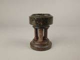 an old wooden candle holder on a white background