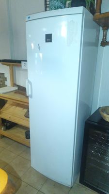 a white refrigerator sitting in a kitchen next to a counter