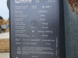 a sign on the side of a pole that says magni