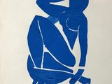 a blue and white drawing of a person sitting on a chair