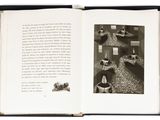 an open book with a black and white picture of a cat