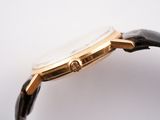 an image of a close up of a watch on a white surface