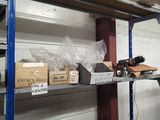 a shelf with boxes and boxes on it in a room