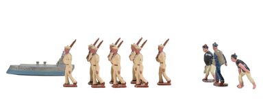 many figurines of men standing in front of a boat