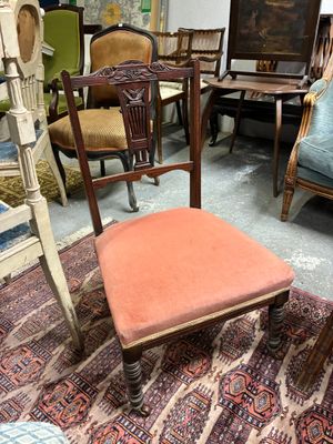 a chair that is sitting on a rug in a room