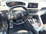 the interior of a car with a steering wheel and dashboard controls