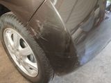 a close up of a car that has been painted black