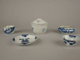 several blue and white porcelain bowls and bowls on a table