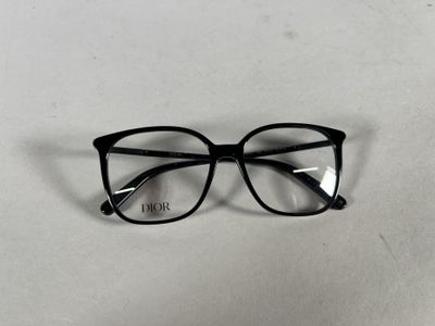 black glasses with clear lenses on a white surface