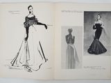 an open book with a drawing of a woman in a dress and a drawing of a woman in a gown