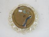 a plate with a blue handle on it on a table
