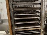 an image of a kitchen with a rack of trays