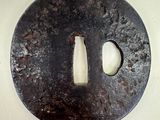 a picture of a round metal object with a hole in the middle