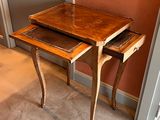 two tables that are sitting next to each other on the floor