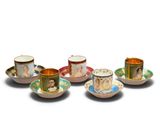 four cups and saucers with a picture of a woman on them