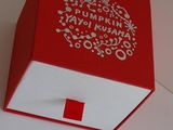 a red and white box with a red cross on it